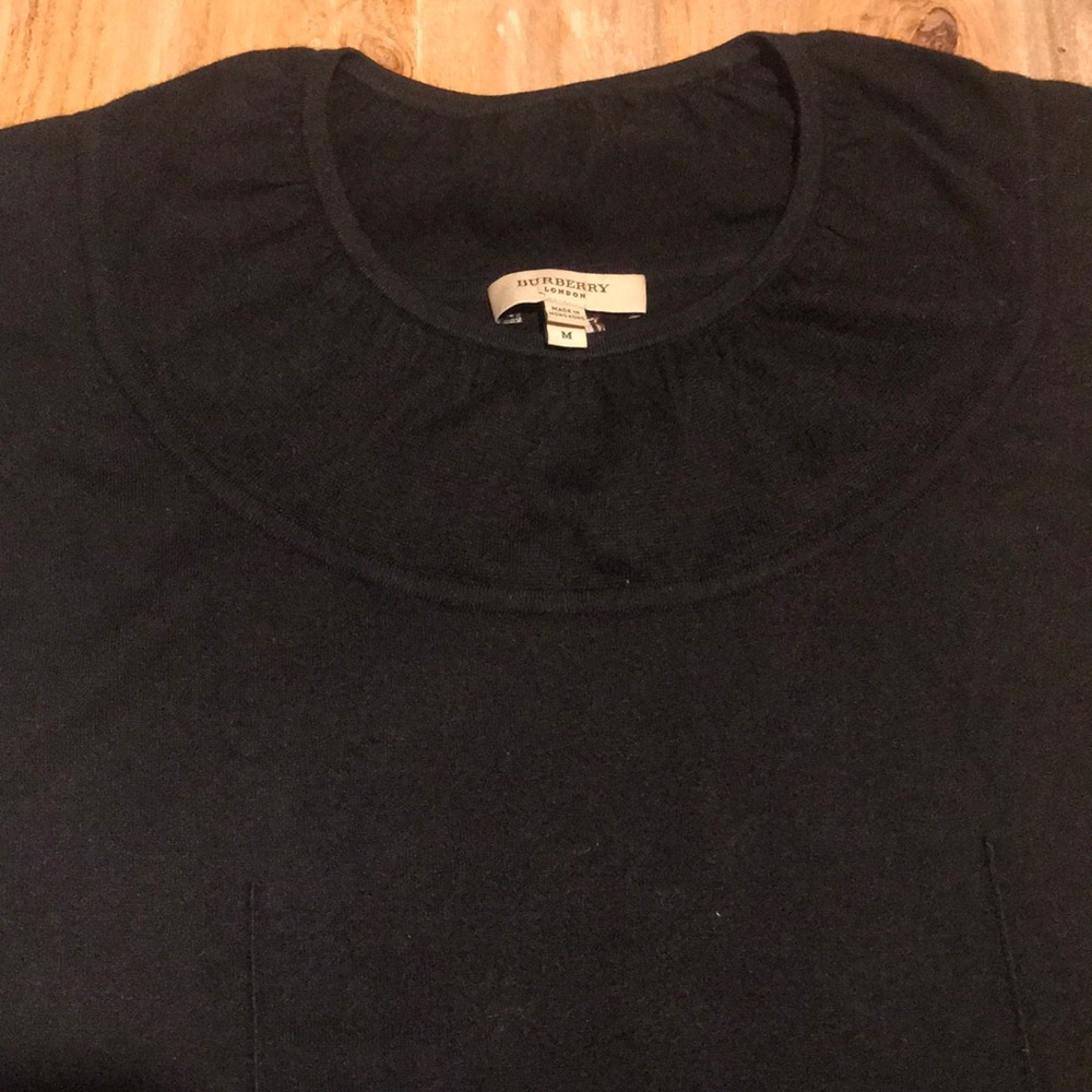 Black size medium short sleeved Burberry sweater.